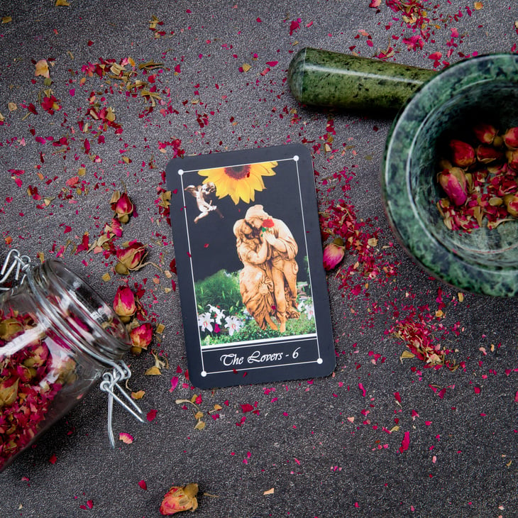 The Lovers card from the Tarot Major Arcana on a card stand