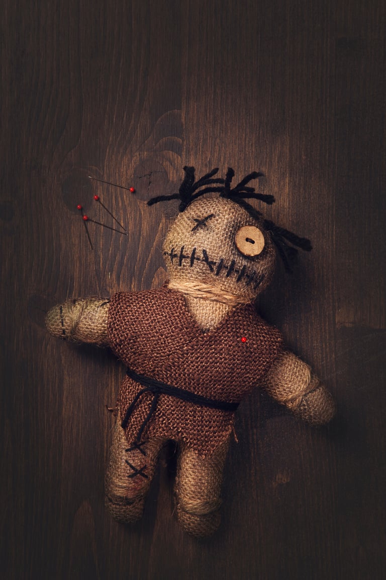 Voodoo doll with pins