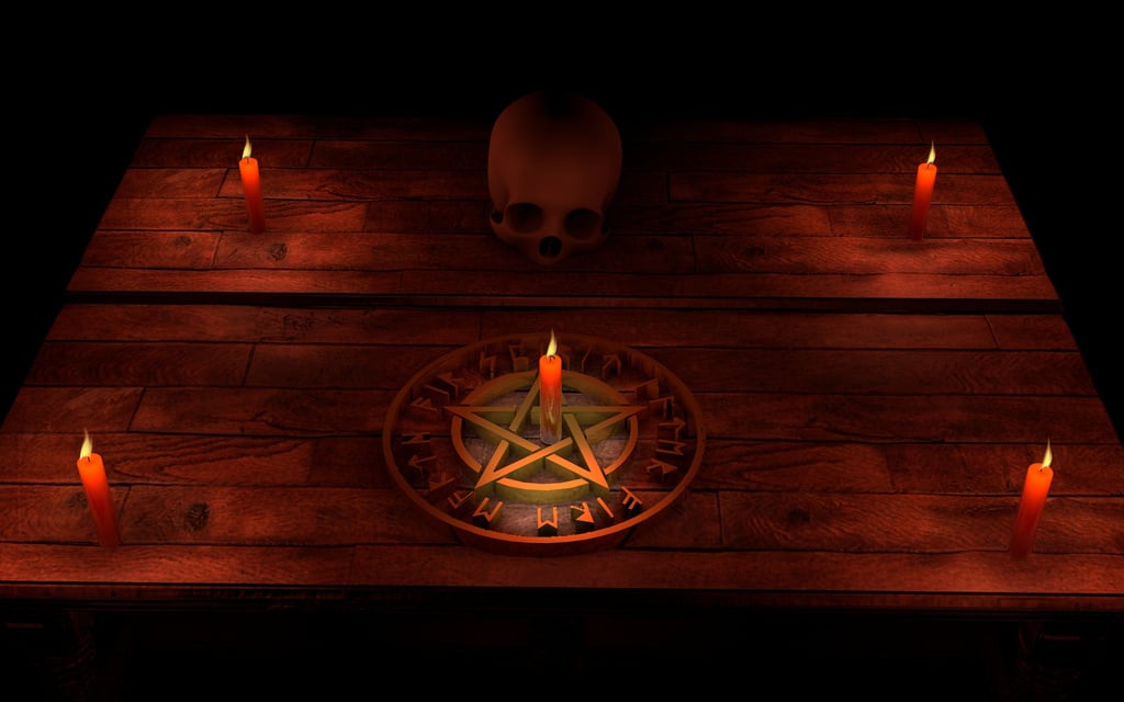 Pentacle, Candles and Skull on a Wooden Table